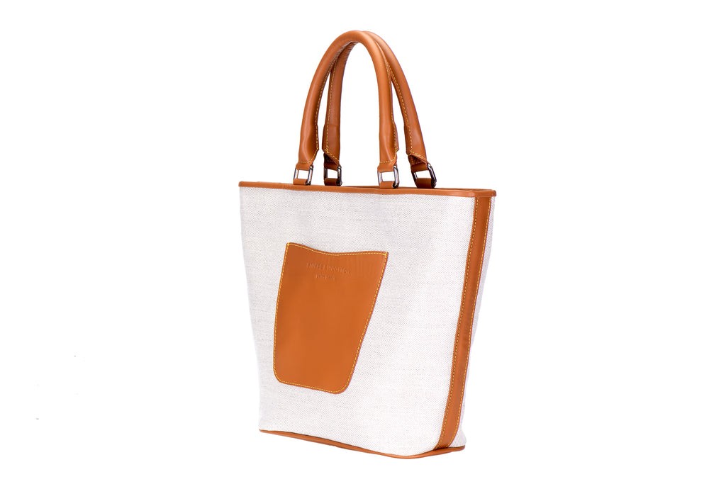 Our Midi Tote Bag is photographed here against a white background.
