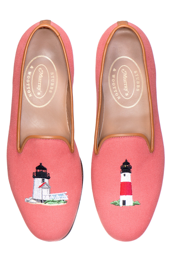 Red slipper with lighthouses on white background.