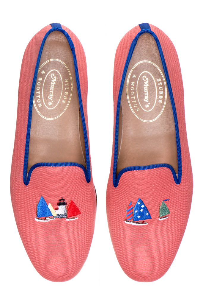 Red slipper with sailboats on white background.