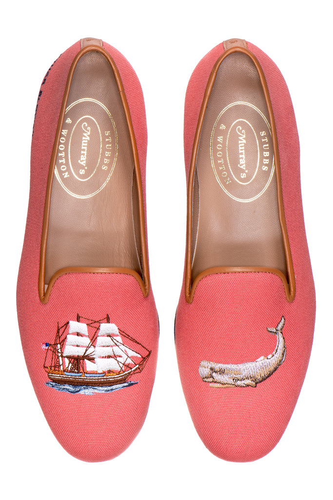 Red slipper with a boat and whale on white background.