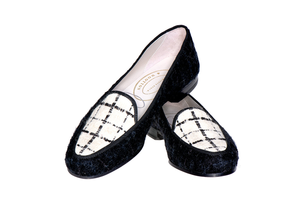 Our tweed black delux slipper on a white background.