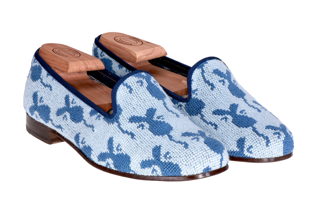 Our needlepoint blue mouse slipper on a white background.