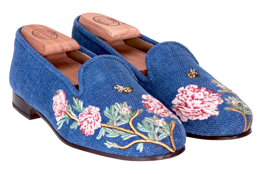 Our blue slipper with pink flowers on a white background.