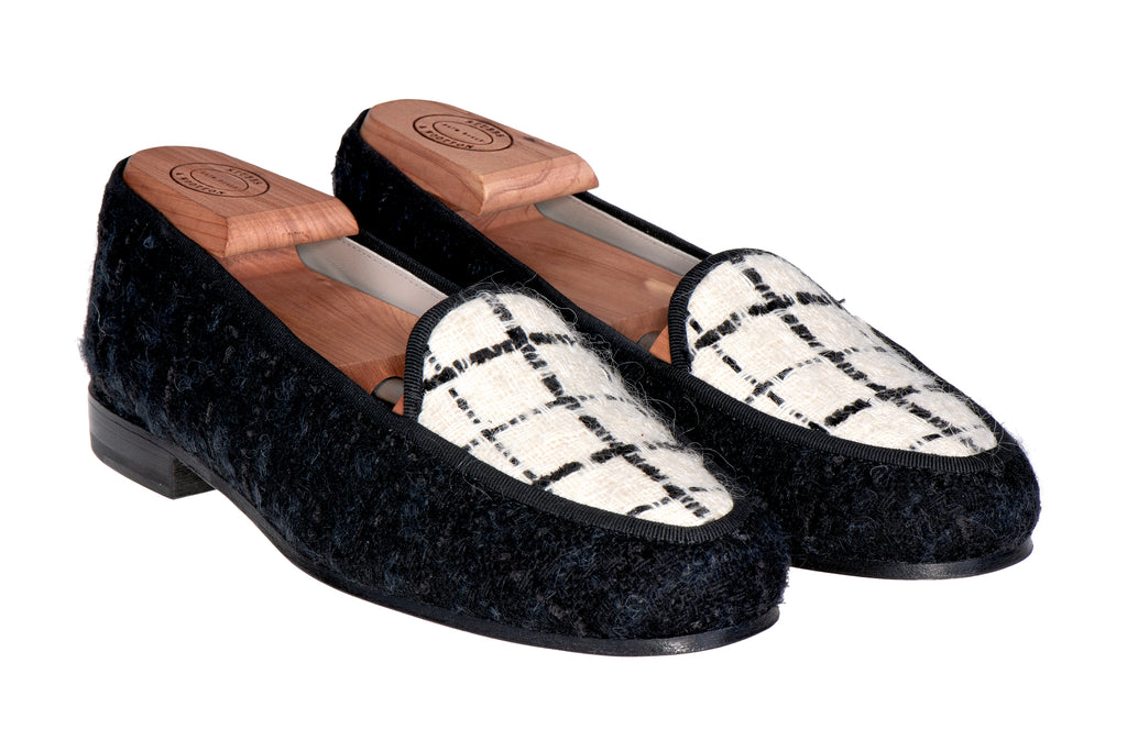 Our tweed black delux slipper on a white background.